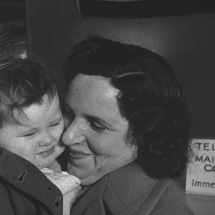 Close view of Malvin Singer holding one of their daughters at Idlewild, about 0:32