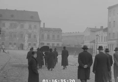 Men carrying a black-covered coffin on Szeroka Street in Kraków, 1936
