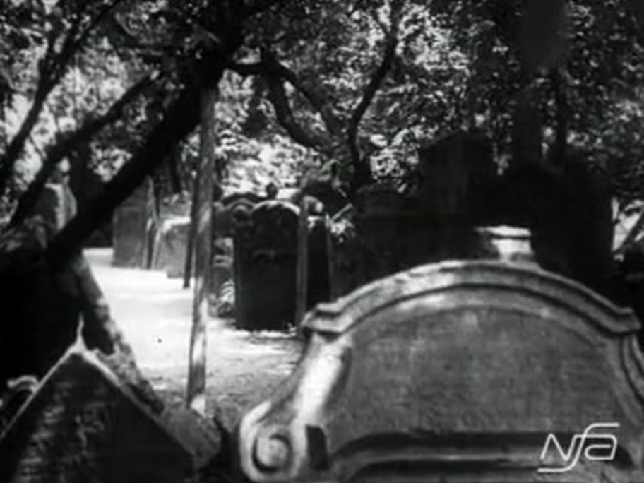 1926 film frame: Old Jewish Cemetery, stones among trees