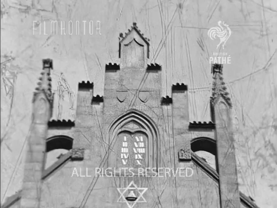 1935 film frame: Maisel Synagogue gable, tight on the Decalogue and the Star of David