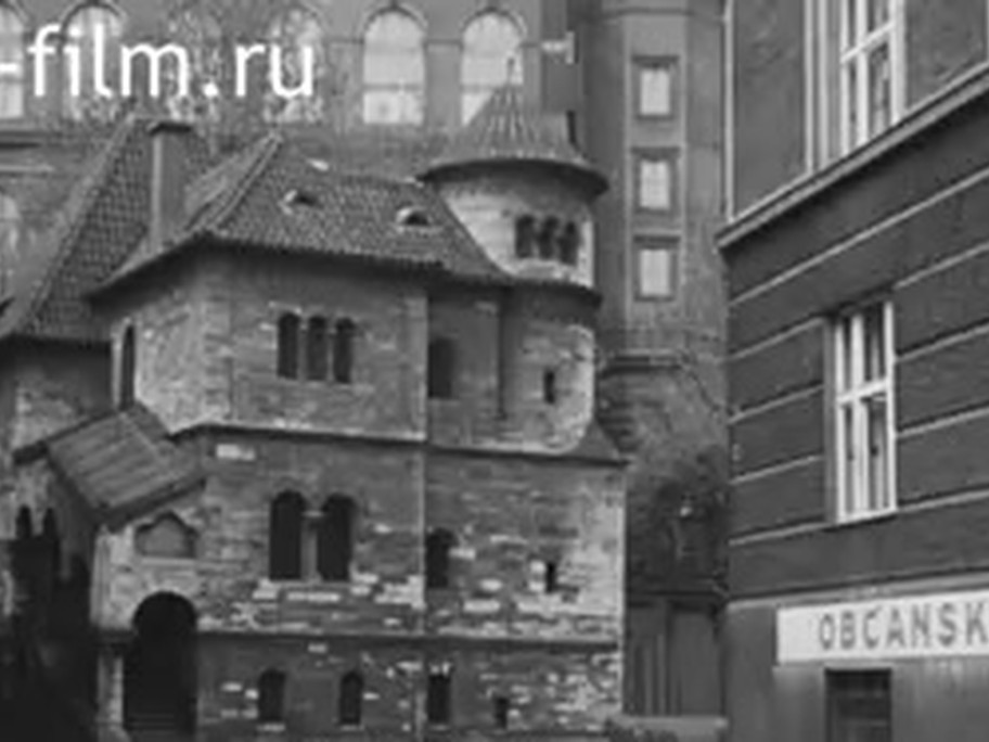 1937 film frame: Ceremonial Hall turret, with a civic banner on the neighboring building to the side