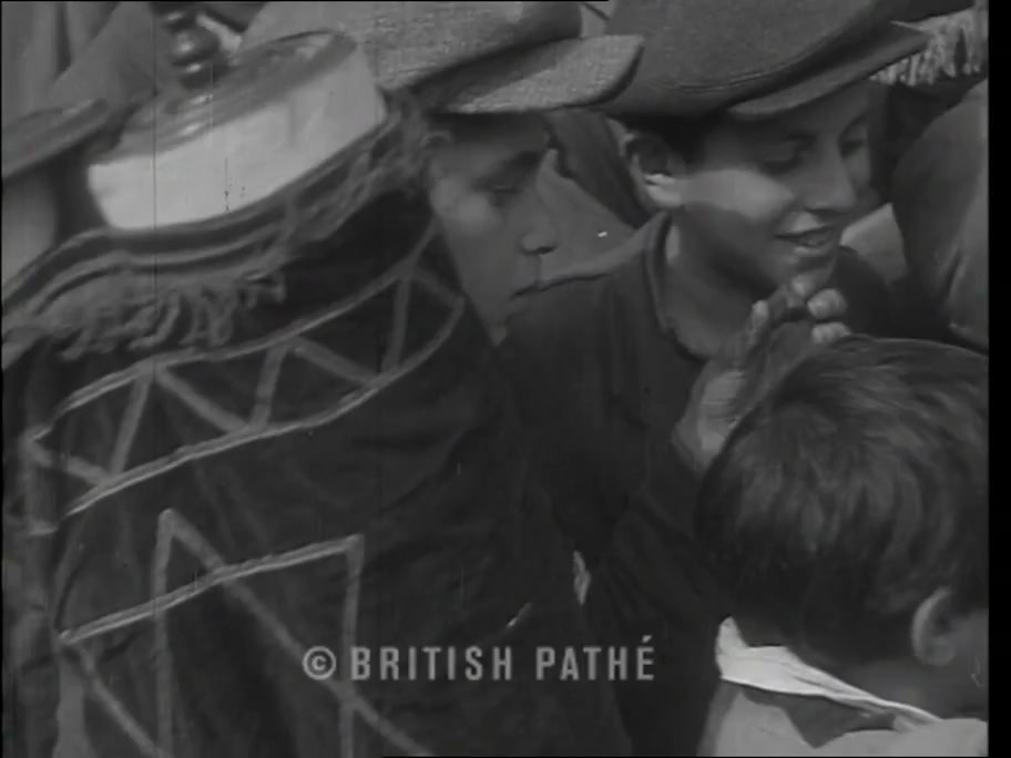 British Pathé frame at about 0:22: boy with a Torah scroll rescued from Poland