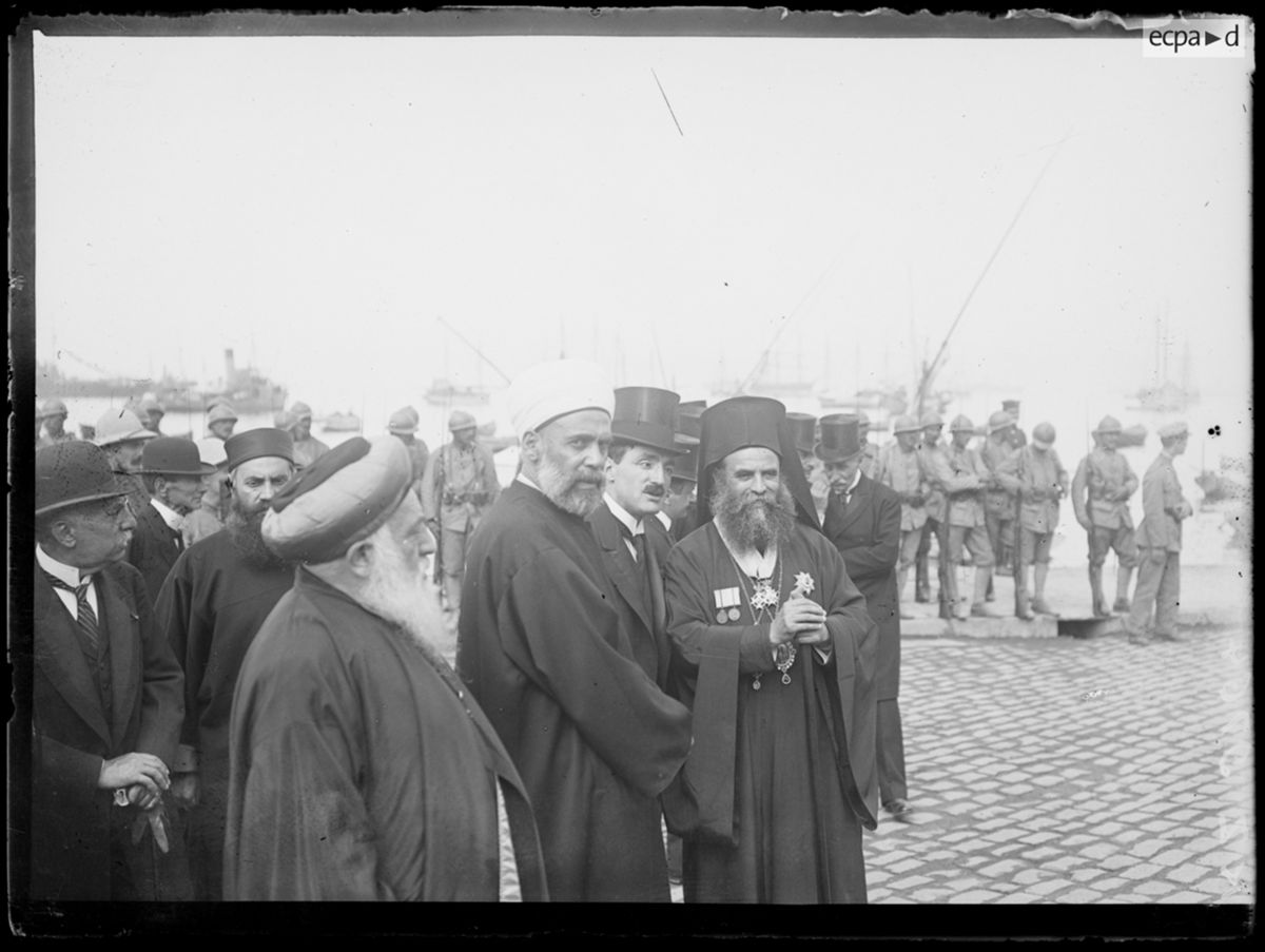 Grand Rabbi, mufti (Muslim religious leader), and metropolitan (Greek Orthodox bishop) waiting for the King of Greece in Salonika