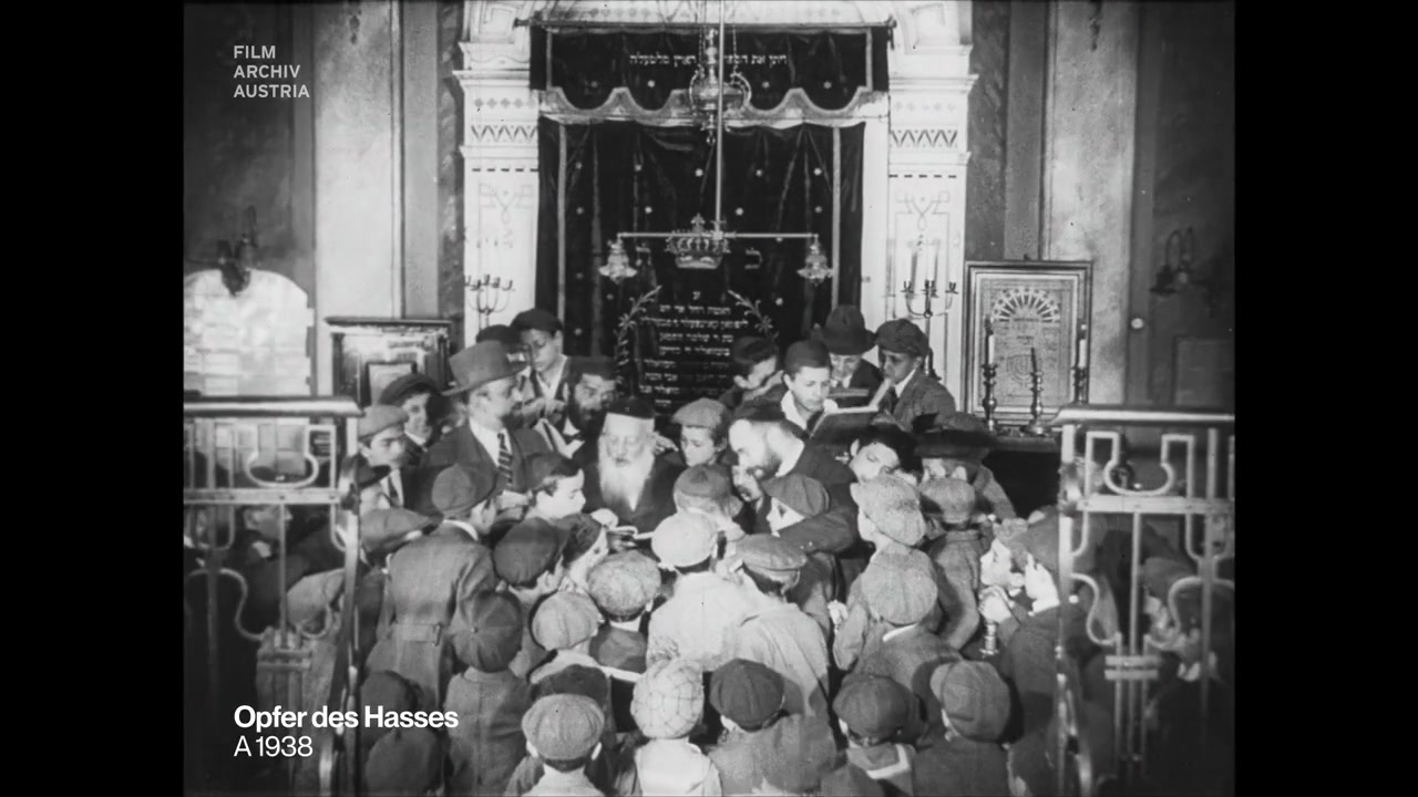 Boys gathered around the older rav at the Vienna Talmud Torah, 1923